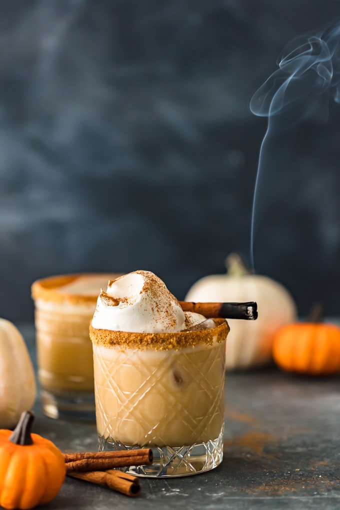 Pumpkin Spice Fall Cocktail in two glasses rimmed with crushed graham crackers