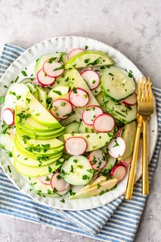 This Creamy Cucumber Salad is just the right mix of healthy veggies and delicious flavor. This easy cucumber salad recipe (cucumbers, radishes, and apples) features a tasty cucumber salad dressing made with mayo and apple cider vinegar. It's a fresh and simple salad perfect for any occasion!