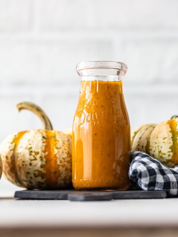 Maple Pumpkin Salad Dressing is the best autumn salad dressing recipe! Nothing says fall like pumpkin, and a bit of maple adds a rich flavor to it. This homemade salad dressing goes with all of your fall salad ideas, and it's the perfect kale salad dressing!