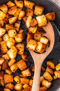 Garlic croutons are so easy to make, and they add the perfect flavor and crunch to your salads. Making croutons on the stove is quick and simple! Just follow this homemade crouton recipe and skip the pre-made ones!