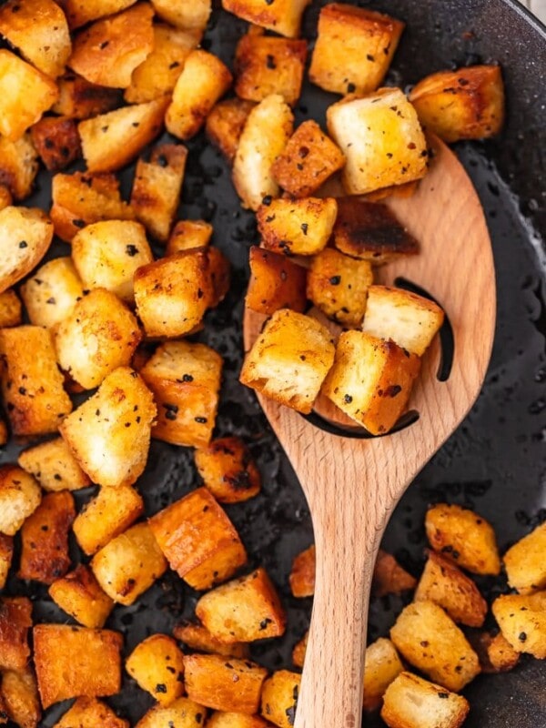 Garlic croutons are so easy to make, and they add the perfect flavor and crunch to your salads. Making croutons on the stove is quick and simple! Just follow this homemade crouton recipe and skip the pre-made ones!