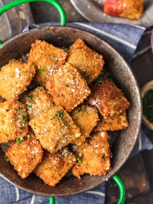 Toasted Ravioli is a classic St. Louis appetizer that deserves worldwide recognition. These deep fried raviolis are crispy, flavorful, and absolutely addicting! This easy fried ravioli recipe is perfect for parties, pre-dinner apps. or pretty much any occasion. Just dip them in marinara sauce and enjoy!