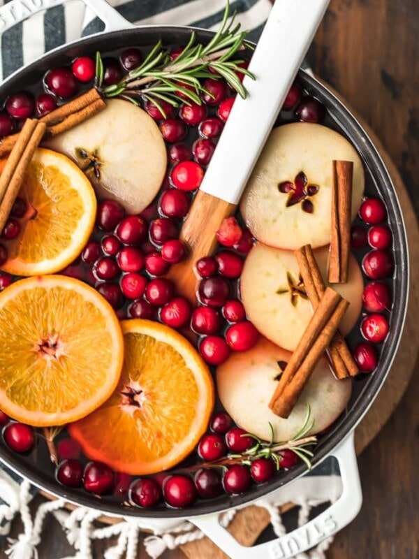 Spiced Cider is a holiday must! Warm things up this season with this delicious Cranberry Apple Hot Cider Recipe. It's easy, it's festive, and it's the perfect drink to serve for any Christmas party. Make it without alcohol for the whole family, or make it spiked hot apple cider for the adults. Either way, the flavor is just perfect!