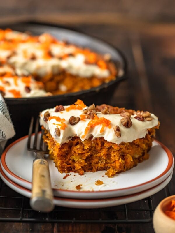 Skillet Carrot Cake is the perfect way to make this delicious dessert without an oven. This easy carrot cake recipe with pineapple is so moist, so flavorful, and so simple! And we're topping it off with the absolute best cream cheese frosting for carrot cake, because it wouldn't be complete without it!