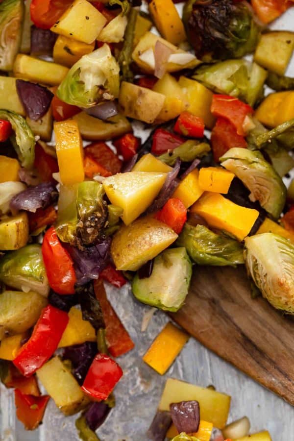 close up view of chopped roasted vegetables on a pan