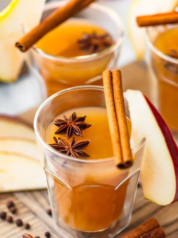 Pear Cider is an awesome fall drink. This Spiced Pear Cider recipe is a blend of pear juice, apple cider, ginger liqueur, and plenty of spice! It's an alcoholic drink, but you can make a non-alcoholic version too. Warm, delicious, and perfect for the holidays!