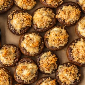 Sausage Stuffed Mushrooms are cheesy, savory, and so delicious! This easy, cheesy sausage stuffed mushroom recipe is the perfect appetizer for holidays, game day, or any special occasion. Mushroom caps are stuffed full of cheese, sausage, onion, and more to create the most amazing flavor!