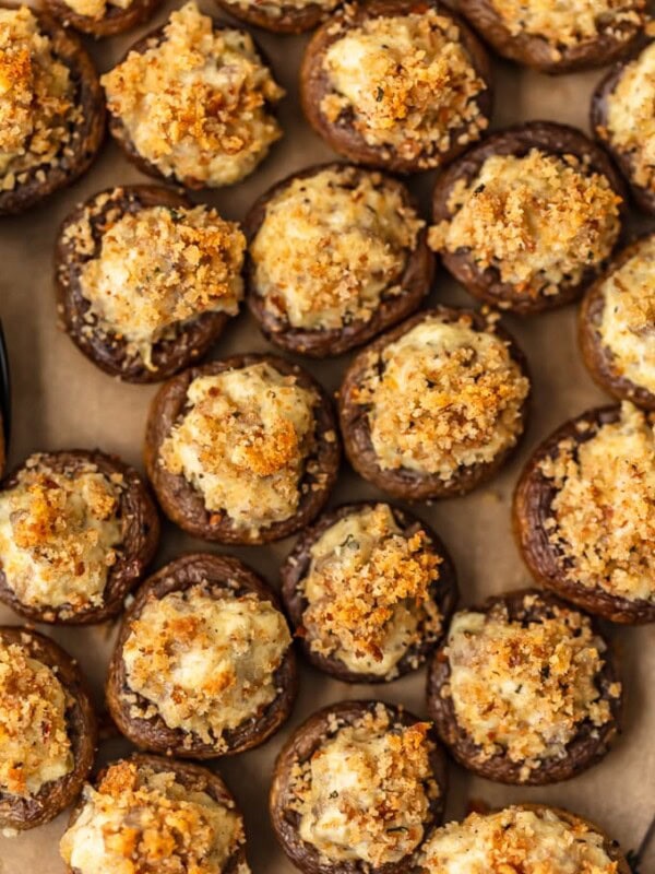 Sausage Stuffed Mushrooms are cheesy, savory, and so delicious! This easy, cheesy sausage stuffed mushroom recipe is the perfect appetizer for holidays, game day, or any special occasion. Mushroom caps are stuffed full of cheese, sausage, onion, and more to create the most amazing flavor!