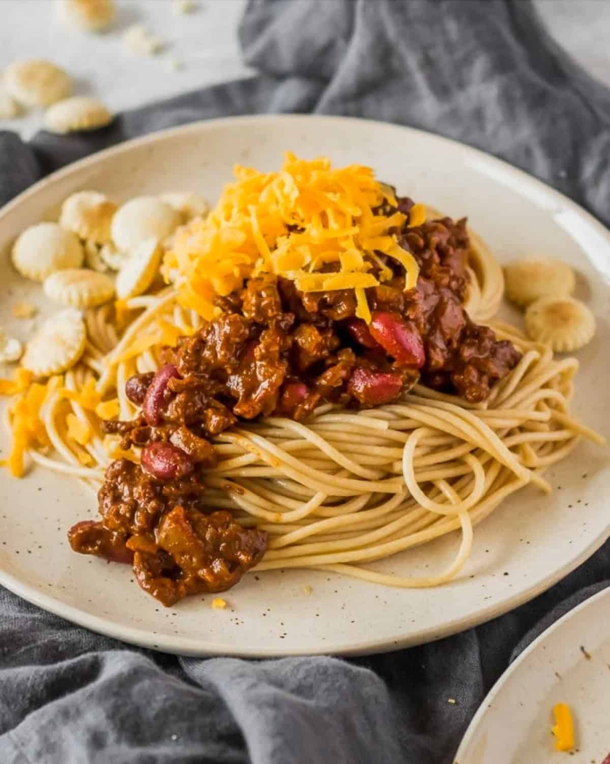 cincinnati chili over spaghetti on plates