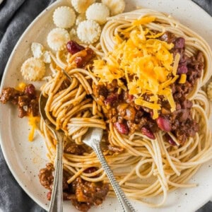 cincinnati chili over spaghetti on plates