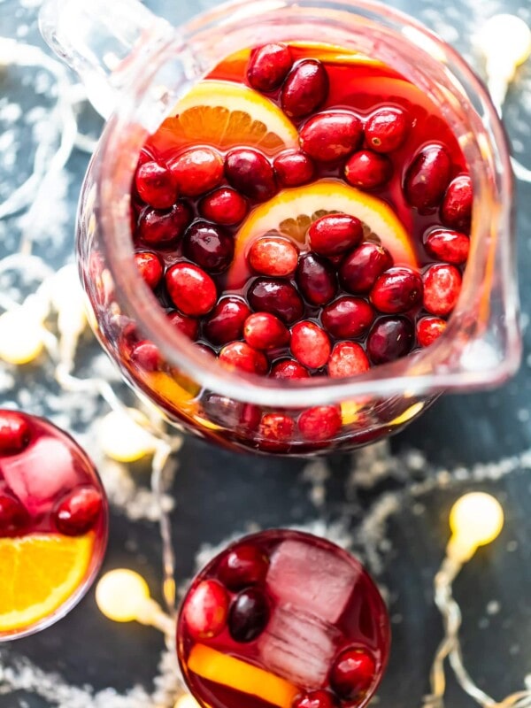 Orange Cranberry Sangria is fresh, fun, and festive. This Christmas Sangria recipe is just perfect for the holiday season!