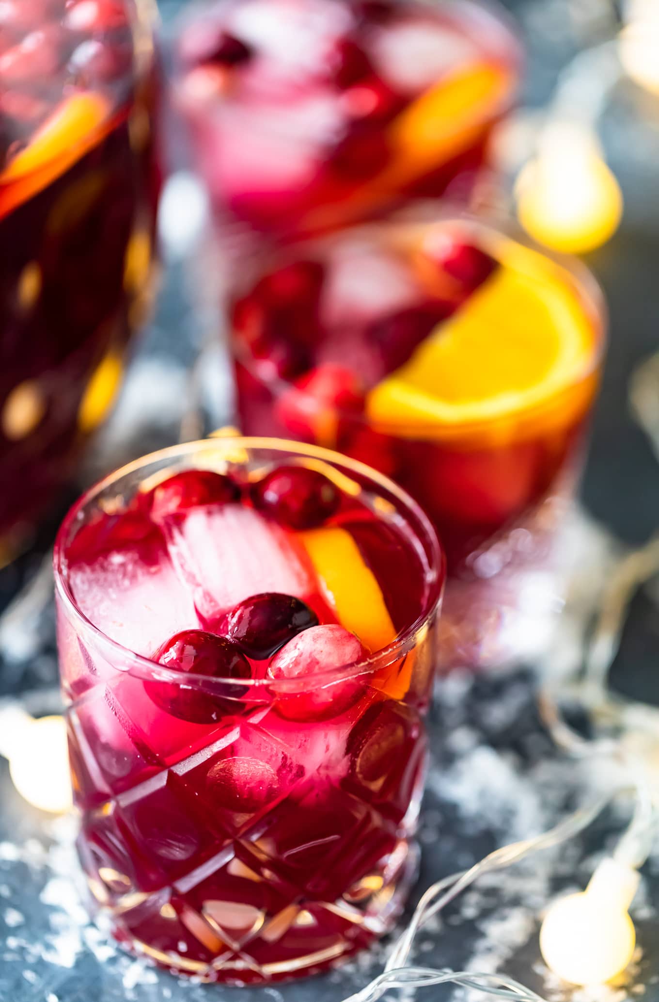glasses of orange cranberry sangria over ice