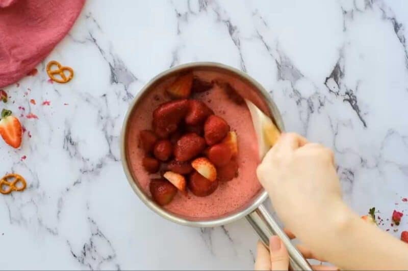 Stir in the frozen strawberries and crushed pineapple.