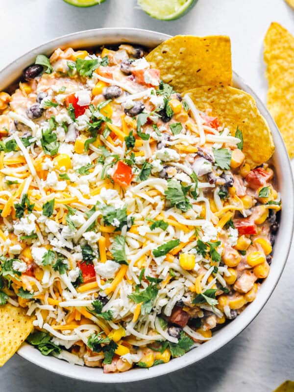 fiesta dip, Mexican dip recipe in a bowl with chips