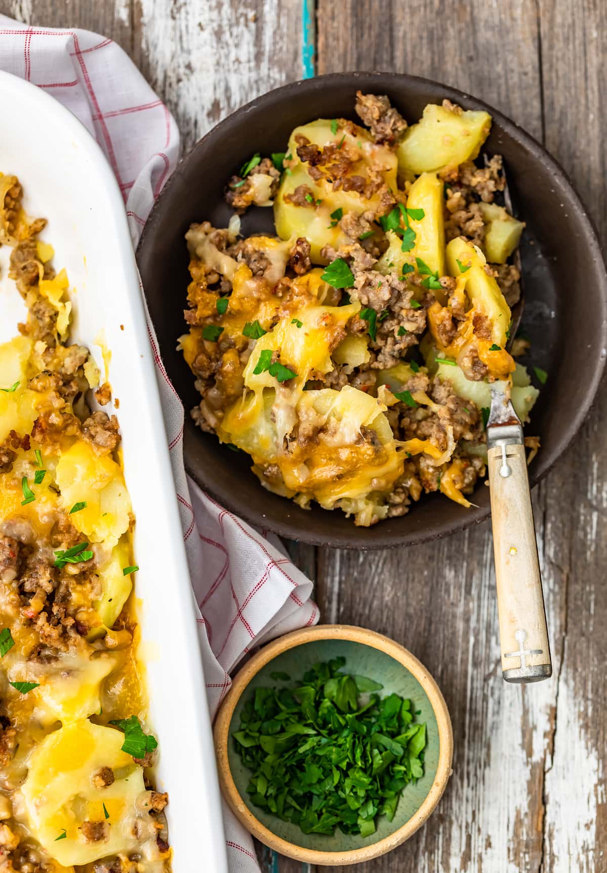 a bowl of cheesy sausage potato casserole