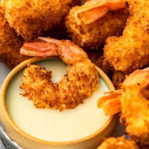 Coconut Shrimp is a crispy, crave-worthy appetizer that everyone will love. It's especially delicious when paired with the perfect coconut shrimp sauce: a Spicy Pina Colada Dipping Sauce! The two go hand in hand, a match made in heaven. And this coconut shrimp recipe is just as good as a main dish as it is as a party appetizer!