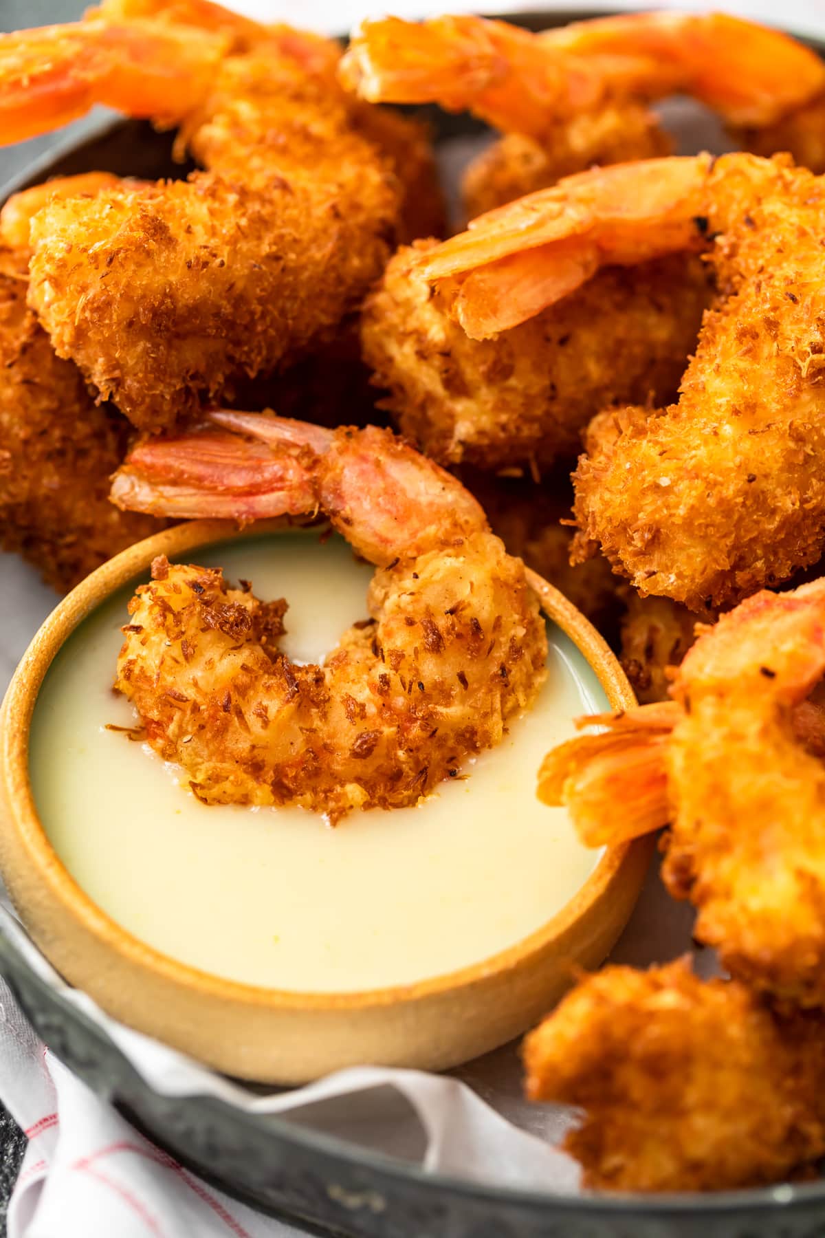 crispy coconut shrimp and a bowl of pina colada sauce.