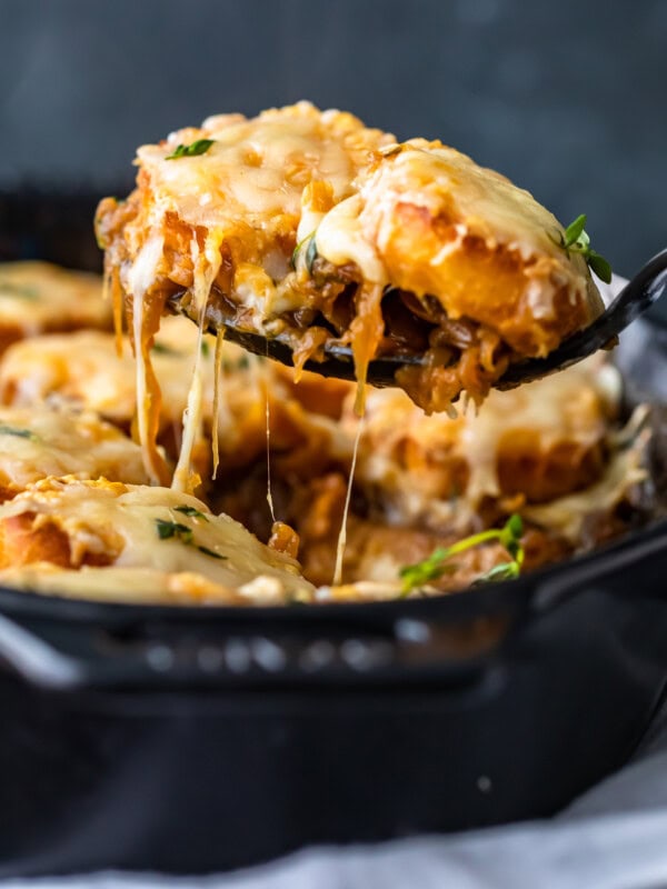 French Onion Soup Casserole is the perfect combination of a classic soup and an easy casserole recipe. This delicious French Onion Casserole is filled with caramelized onions, crunchy baguettes, and plenty of cheese. It tastes just like the soup, but in an easy to make weeknight dinner! I love this easy French Onion Soup Casserole!