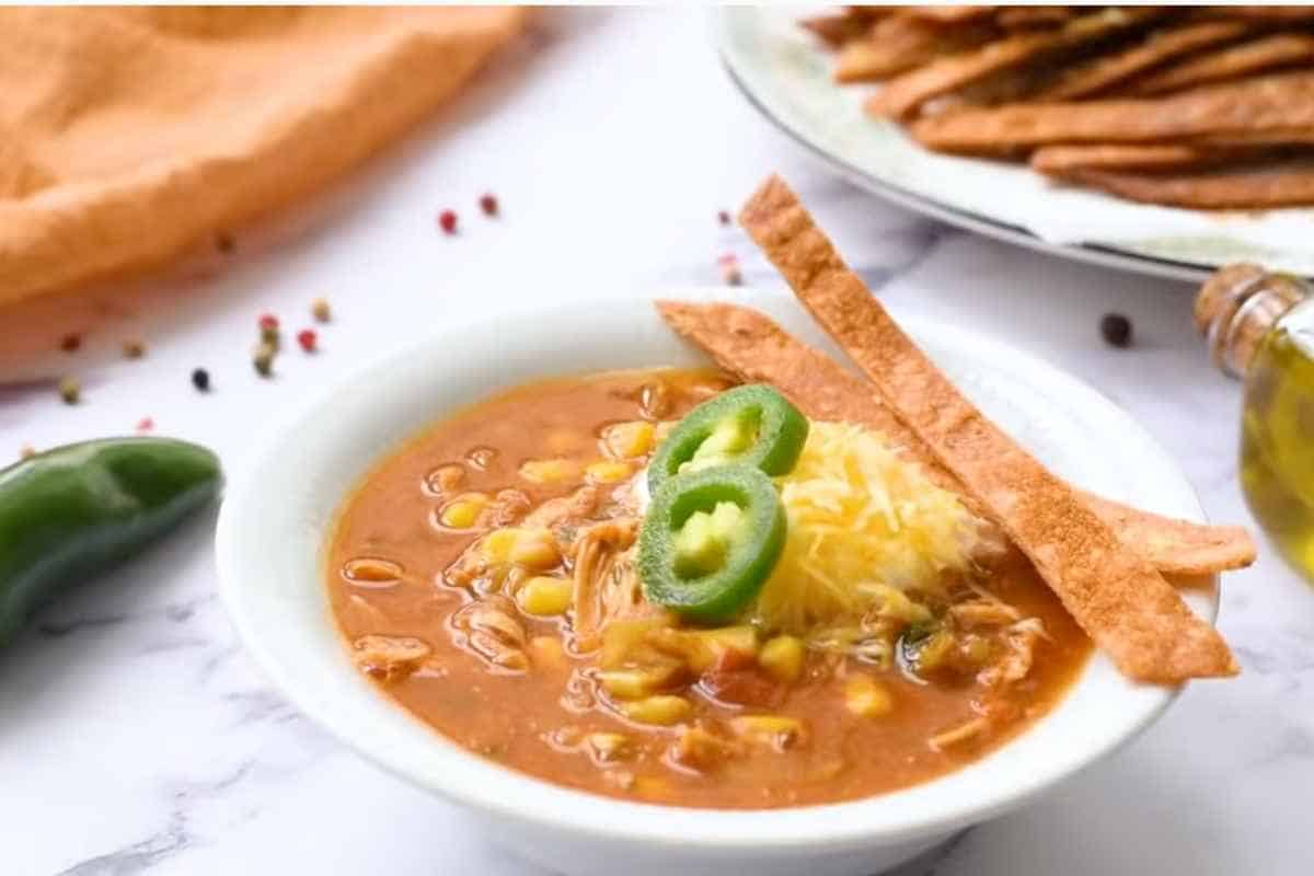 serve and top with extra cilantro, sour cream, tortilla strips.