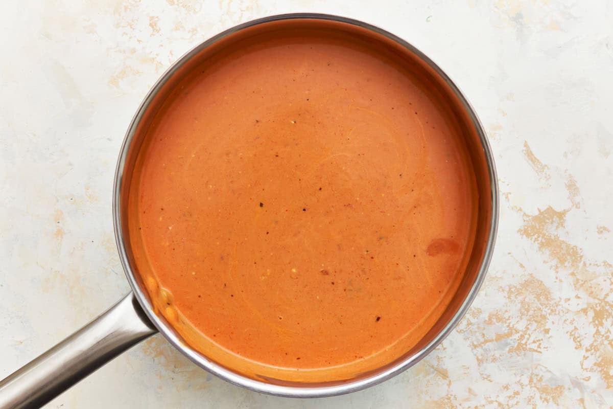 creamy marinara sauce in a saucepan.