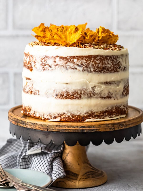 Hummingbird Cake is a sweet and delicious dessert for any occasion. This beautiful banana pineapple cake with cream cheese frosting is a popular Southern cake recipe that everyone should try. Make this Hummingbird Cake recipe (with pineapple flowers) for Easter, bridal showers, and more!