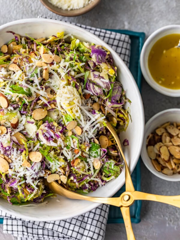 Shaved Brussels Sprout Salad is a simple side dish to serve with any meal. Brussels Sprouts, toasted almonds, and cheese are tossed with a Honey Lemon Dijon Vinaigrette for a light and delicious flavor. This shaved Brussels Sprouts recipe is so easy and can be made in no time!