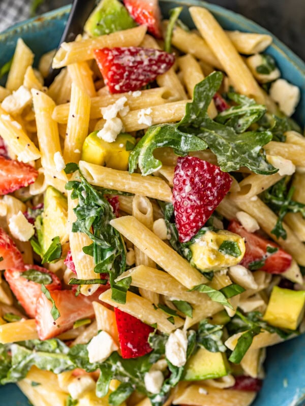 Strawberry Avocado Pasta Salad is an easy and tasty summer pasta salad recipe that everyone will love! This penne pasta salad with feta, strawberries, avocado, poppy seed dressing and more is so light and fresh. Serve it warm or serve it cold, either way, it's sure to be a hit!