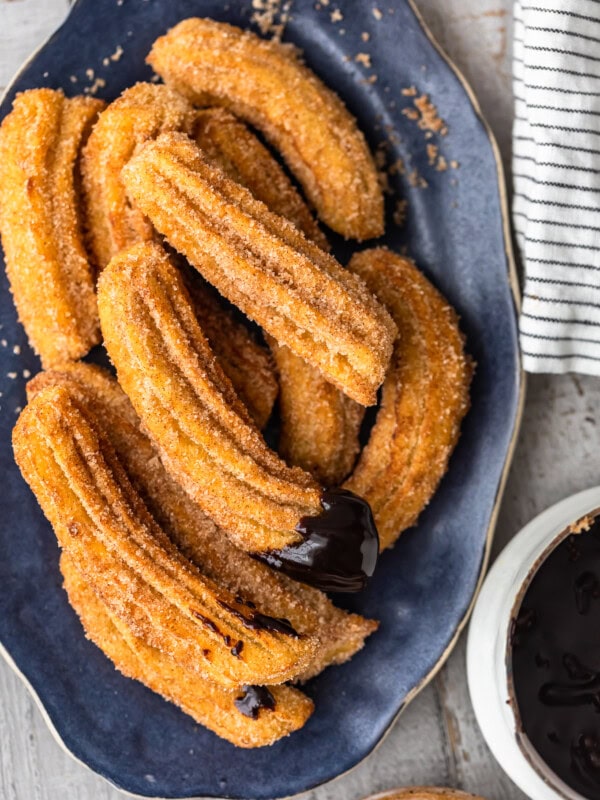 Churros are one of the best treats ever, and this easy churros recipe means you can make them at home any time you want. Better yet, they're gluten free! Dip these fried cinnamon sugar snacks in chocolate sauce for the ultimate delight!