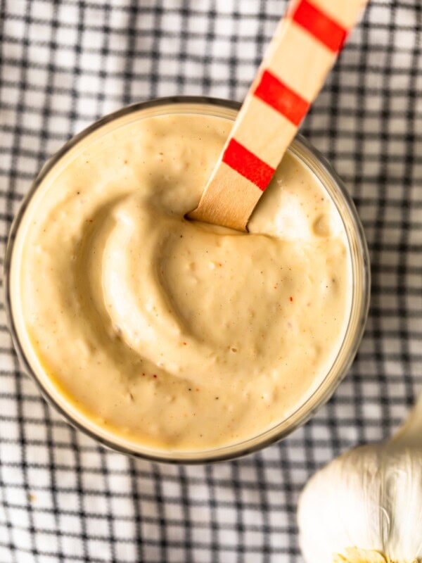 Garlic Aioli is a super flavorful sauce that goes with so many recipes. This creamy Roasted Garlic Aioli recipe is easy, tasty, and slightly addicting. It's one of my favorite dips for fries, and goes perfectly with vegetables, chicken, fish, and more! Let me show you how to make the BEST aioli!