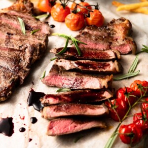 sliced new york strip steak on a plate