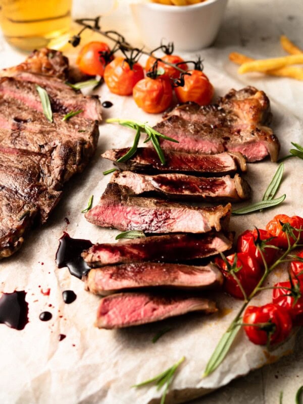 sliced new york strip steak on a plate