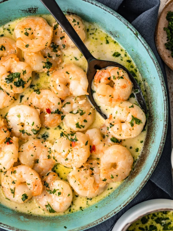 Garlic Shrimp is a simple, easy recipe to make for appetizers or for dinner. This spicy garlic shrimp recipe is just SO tasty, and only takes about 10 minutes to makes. Serve this sauteed garlic shrimp as a quick app, or turn it into a creamy garlic shrimp pasta. Either way, everyone will love it!