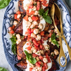 grilled caprese bruschetta chicken on a plate