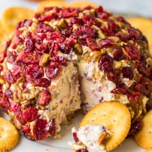 christmas cheese ball on a plate with crackers