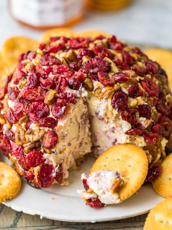 christmas cheese ball on a plate with crackers