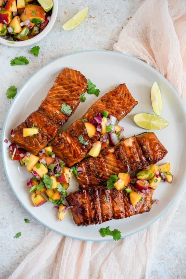 A plate of food on a table, with Salmon and Salsa