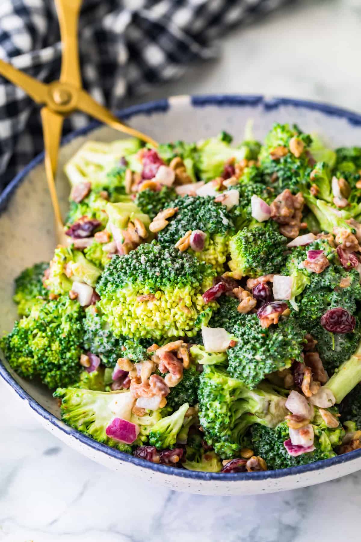 Close up of Broccoli salad in a blue and white bowl