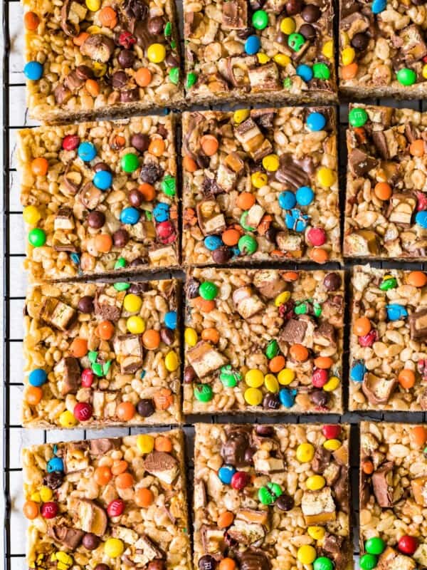 candy bar rice crispy treats cut into squares on cooling rack