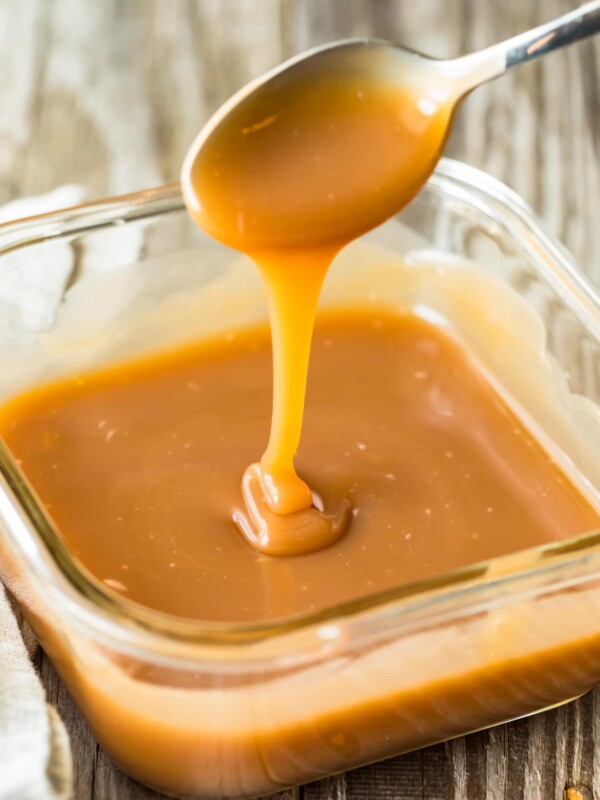 caramel falling from spoon into dish