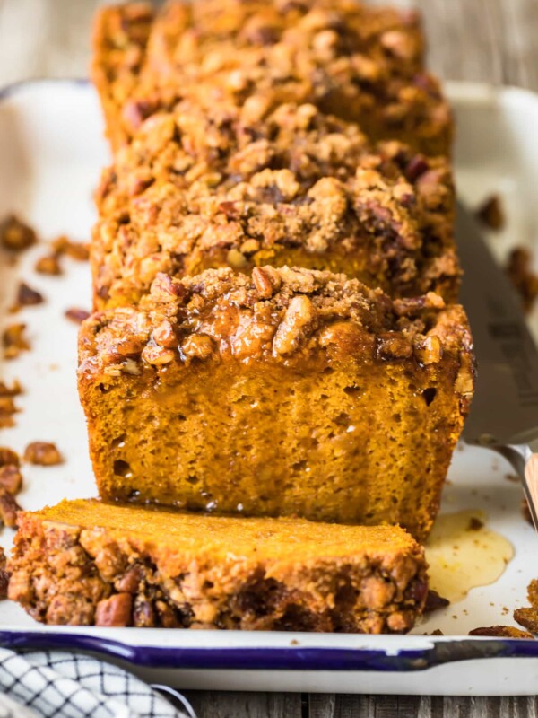 sliced loaf of oatmeal pumpkin bread on a plate