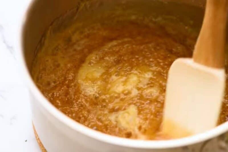 adding unsalted butter in the sugar syrup