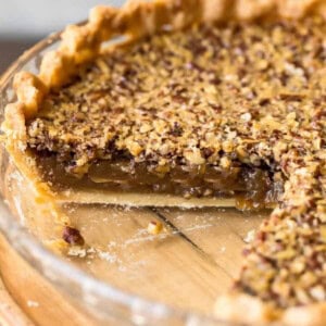 A Classic Pecan Pie with a slice taken out.