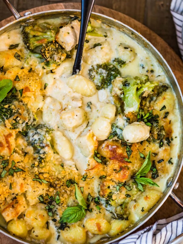 Chicken Alfredo Gnocchi Bake with gnocchi being scooped up