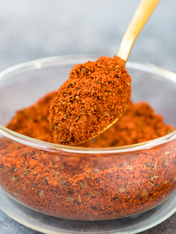 homemade chili seasoning being scooped up with a spoon