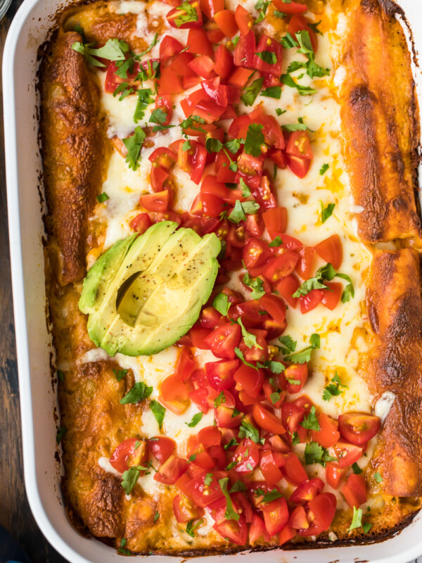 chicken enchiladas topped with avocado