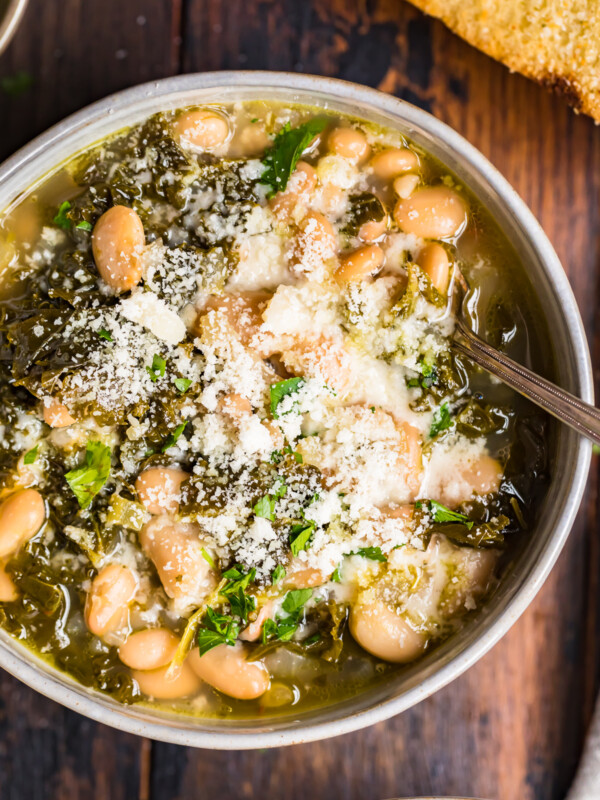 white bean parmesan soup with kale in a bowl