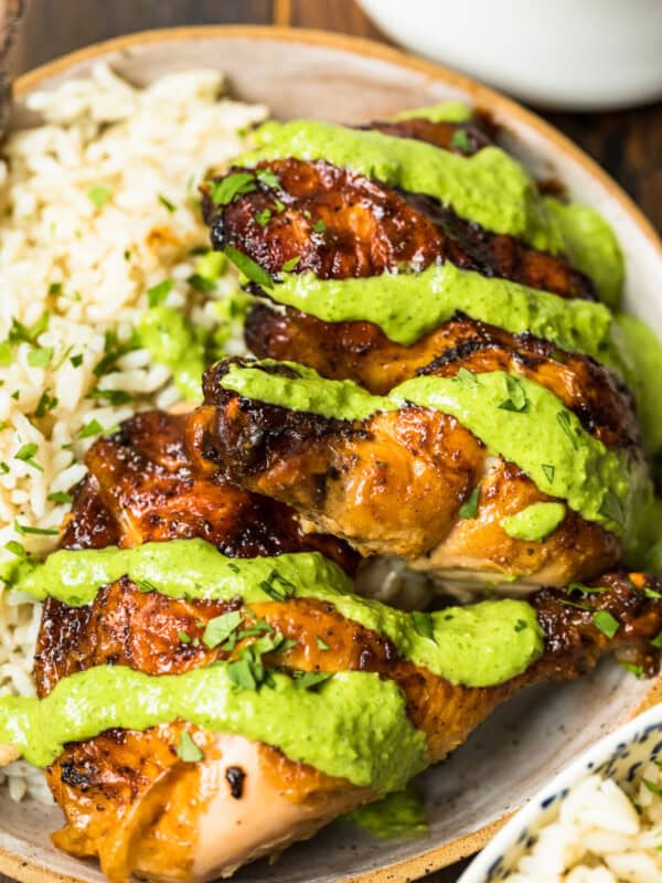 peruvian chicken with green sauce on plate