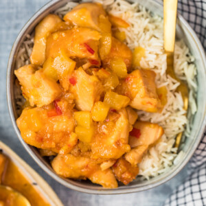 sweet and sour chicken in a bowl with rice