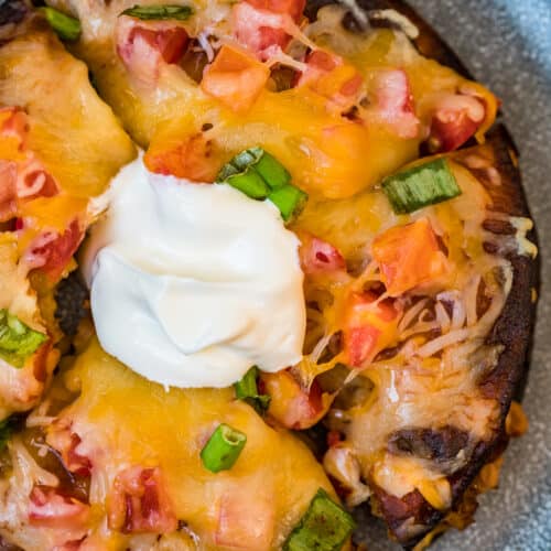 beef mexican pizza topped with sour cream