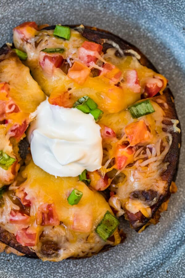 homemade mexican pizza topped with sour cream